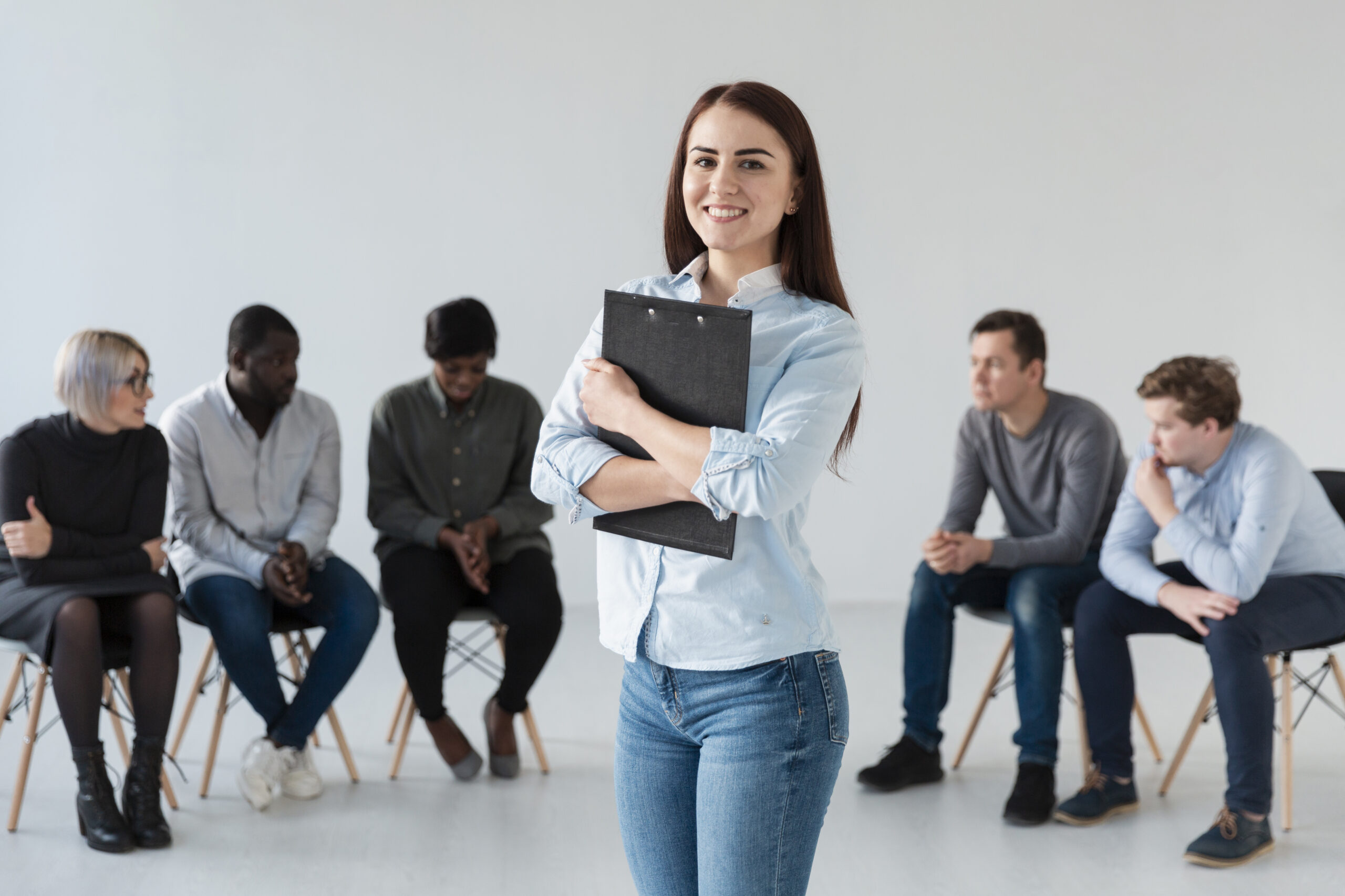 portrait-smiling-woman-holding-clipboard